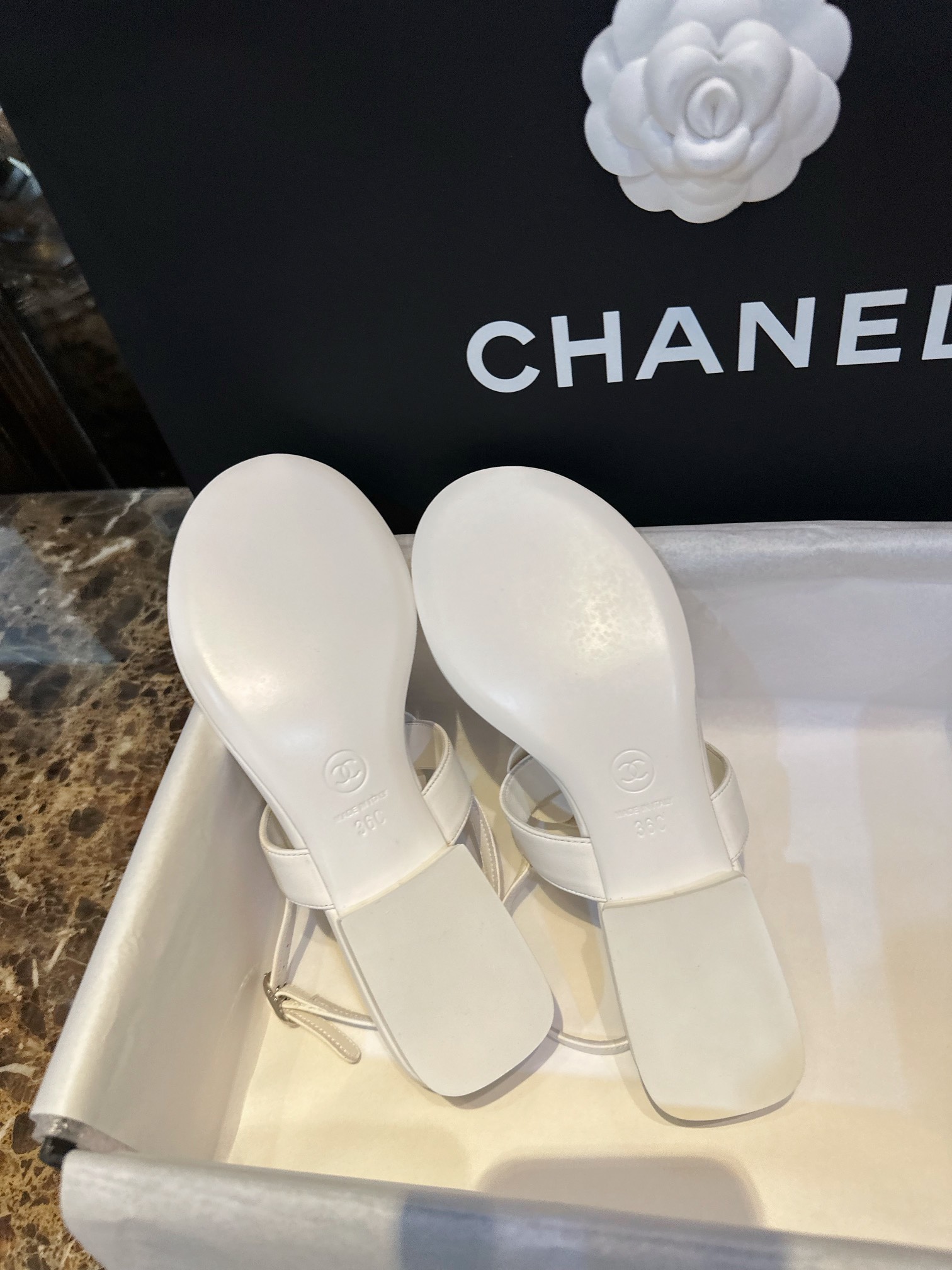 Chanel All White Camellia Sandals: Elegant Toe-Strap Design with Pure Dyed Sheepskin and Leather Sole