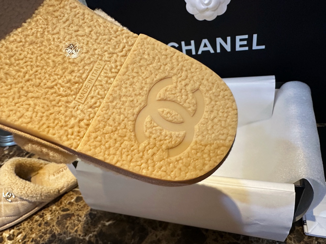 Chanel Shearling Grid Pattern Slide Sandals: Warmth and Style Combined with Luxurious Sheepskin and Cozy Shearling