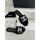 Chanel Black Double C Embroidered Slides: Featuring a Striking Black and White Color Block Design on the Upper, Karen Satin Fabric with Imported Thread Embroidery, Finished with a White Leather Sole. 