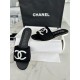 Chanel Black Double C Embroidered Slides: Featuring a Striking Black and White Color Block Design on the Upper, Karen Satin Fabric with Imported Thread Embroidery, Finished with a White Leather Sole. 