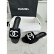 Chanel Black Double C Embroidered Slides: Featuring a Striking Black and White Color Block Design on the Upper, Karen Satin Fabric with Imported Thread Embroidery, Finished with a White Leather Sole. 