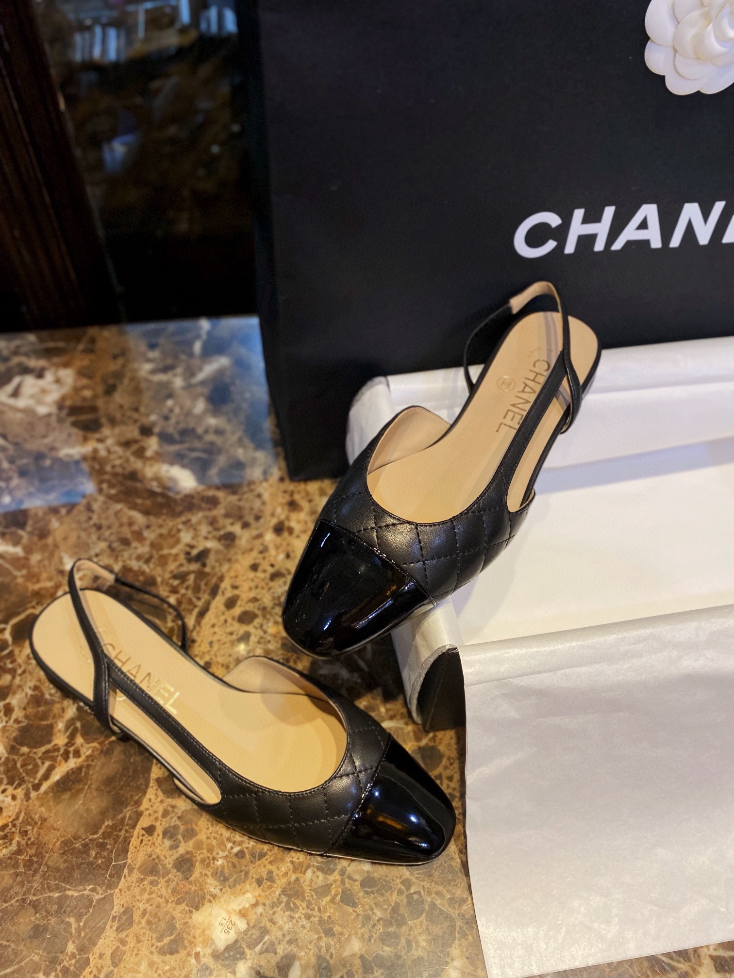 Chanel Black Diamond Pattern Flat Slingback: Imported Lamb Leather with Patchwork Cow Patent Leather Toe, 