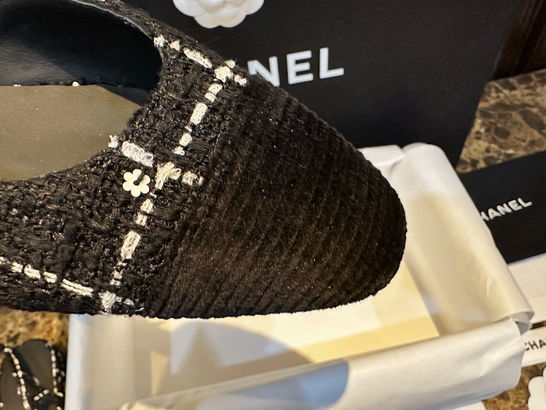 Chanel  Camellia Pattern Flat Shoes with Black and White Grids, Embellished with Sparkling Tweed, Cozy Sheepskin Lining, and Italian Imported Leather Sole.