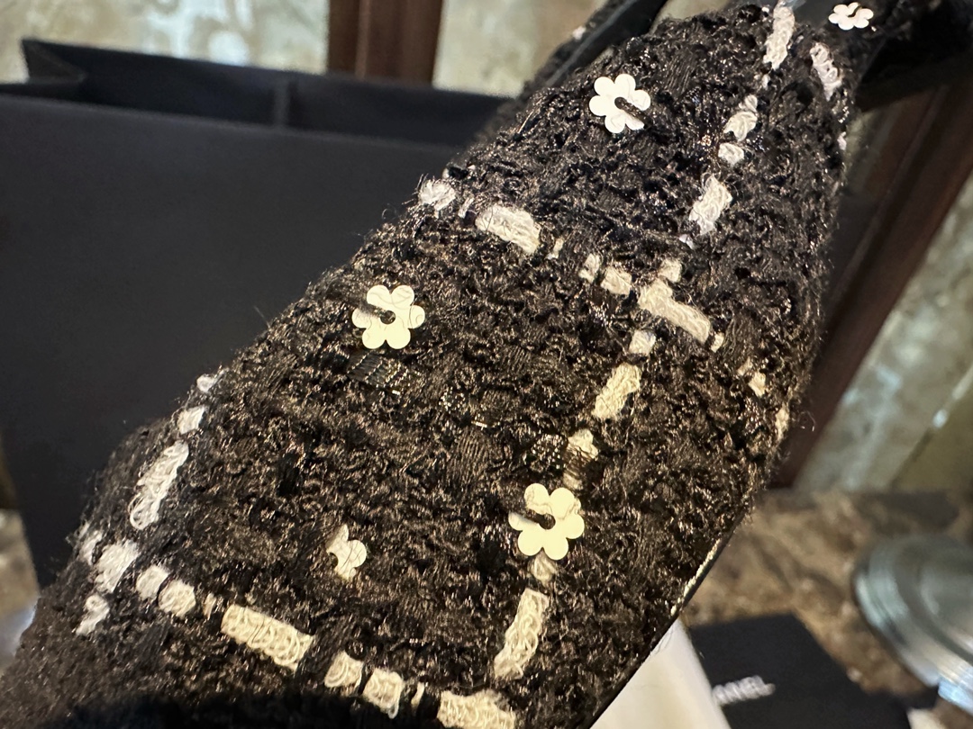 Chanel  Camellia Pattern Flat Shoes with Black and White Grids, Embellished with Sparkling Tweed, Cozy Sheepskin Lining, and Italian Imported Leather Sole.