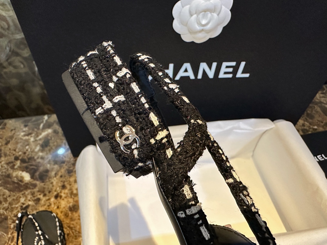 Chanel  Camellia Pattern Flat Shoes with Black and White Grids, Embellished with Sparkling Tweed, Cozy Sheepskin Lining, and Italian Imported Leather Sole.