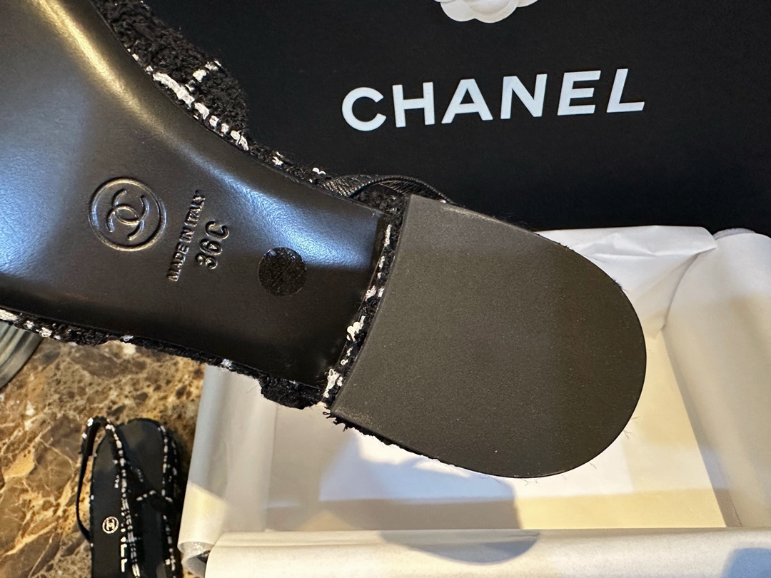 Chanel  Camellia Pattern Flat Shoes with Black and White Grids, Embellished with Sparkling Tweed, Cozy Sheepskin Lining, and Italian Imported Leather Sole.