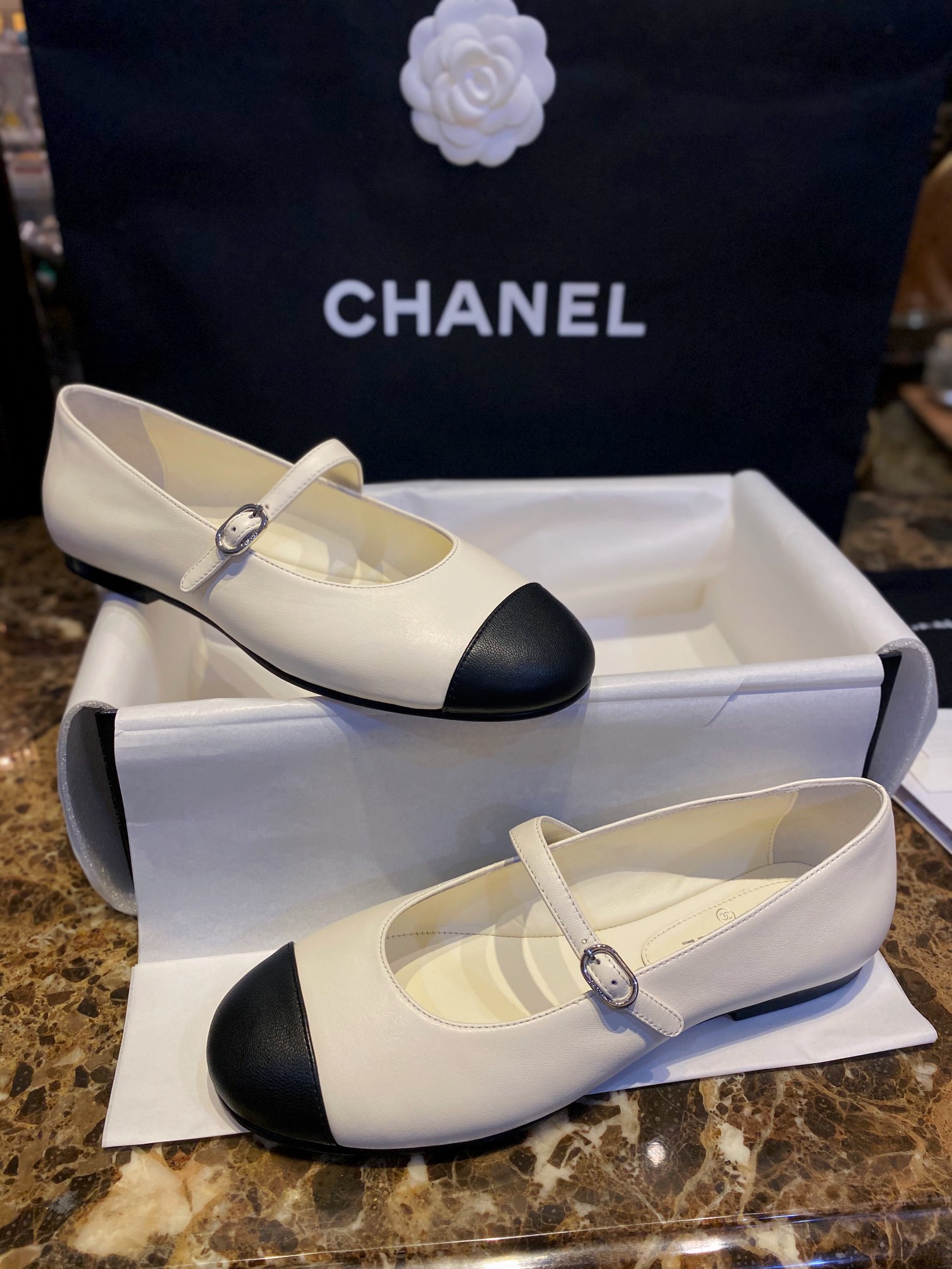 Chanel Classic White Mary Janes in Genuine Sheepskin, Adorned with Petite Double C Buckles for a Playful Twist