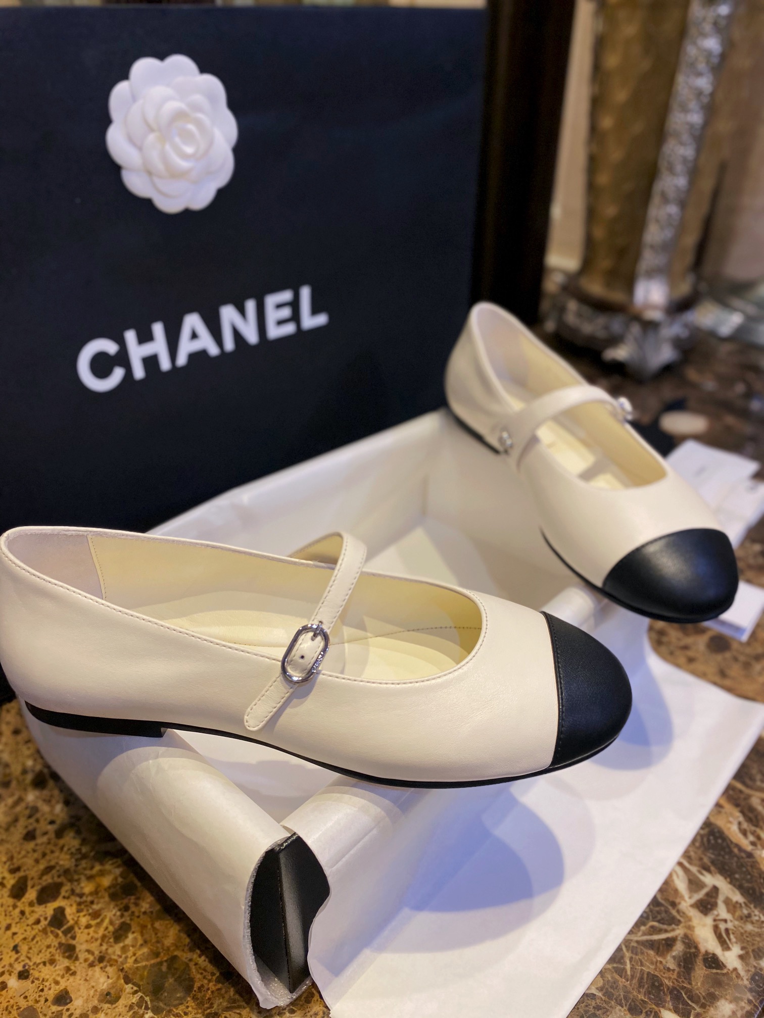 Chanel Classic White Mary Janes in Genuine Sheepskin, Adorned with Petite Double C Buckles for a Playful Twist