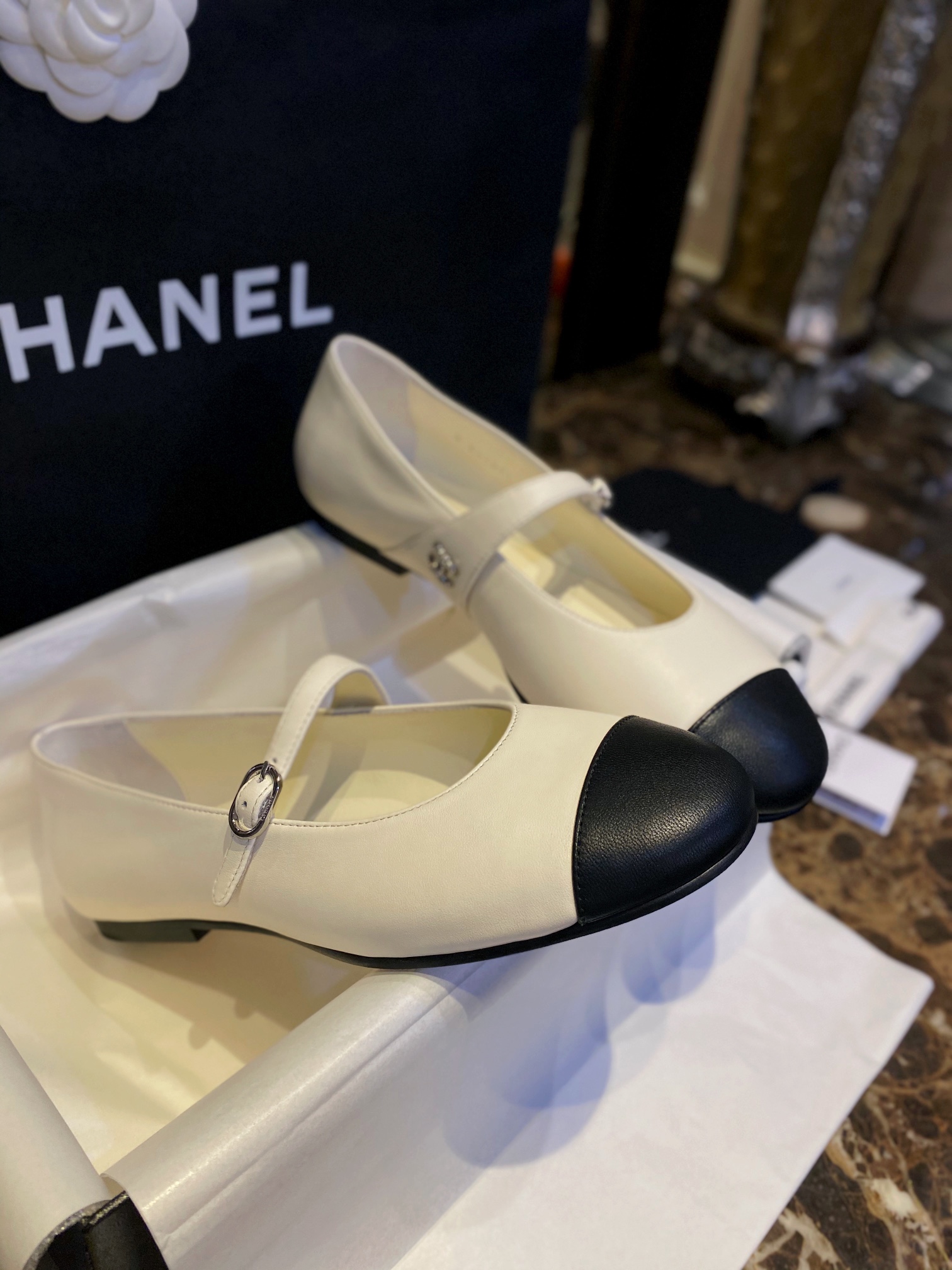 Chanel Classic White Mary Janes in Genuine Sheepskin, Adorned with Petite Double C Buckles for a Playful Twist