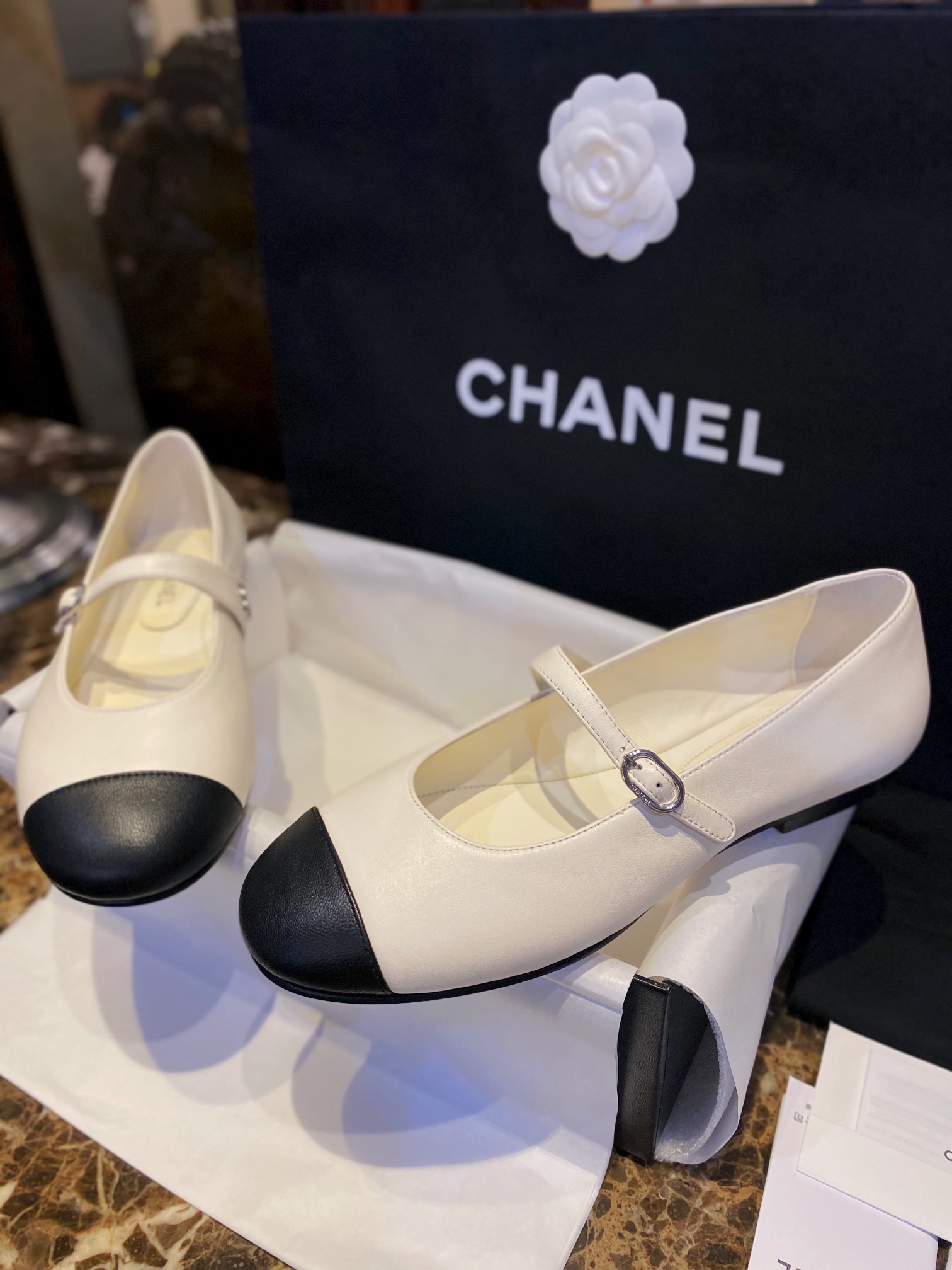 Chanel Classic White Mary Janes in Genuine Sheepskin, Adorned with Petite Double C Buckles for a Playful Twist