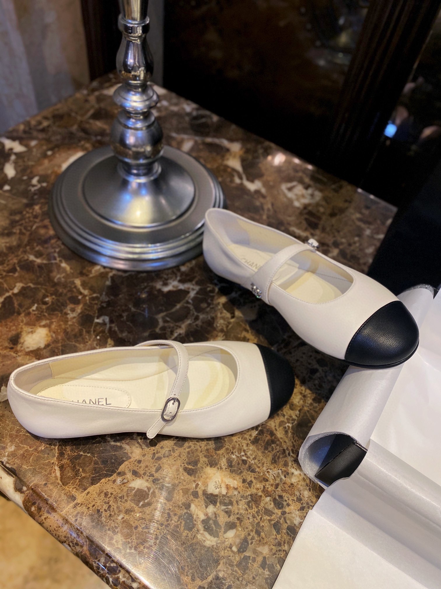 Chanel Classic White Mary Janes in Genuine Sheepskin, Adorned with Petite Double C Buckles for a Playful Twist