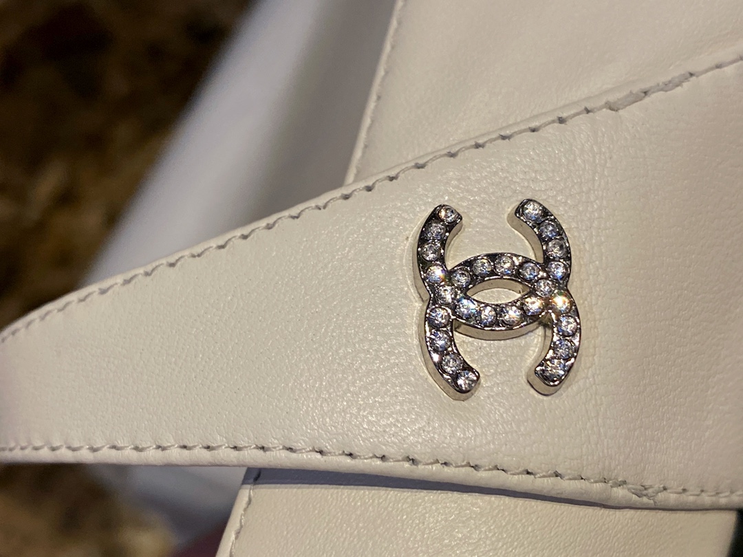 Chanel Classic White Mary Janes in Genuine Sheepskin, Adorned with Petite Double C Buckles for a Playful Twist