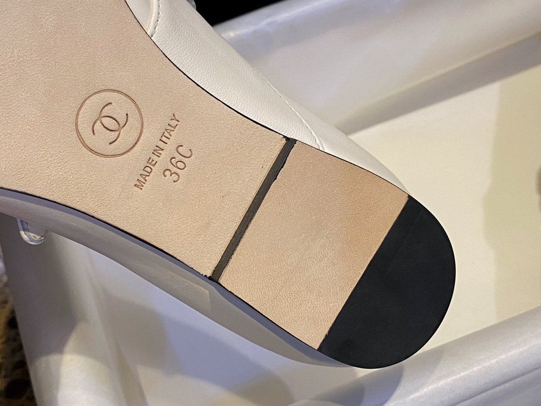 Chanel Classic White Mary Janes in Genuine Sheepskin, Adorned with Petite Double C Buckles for a Playful Twist