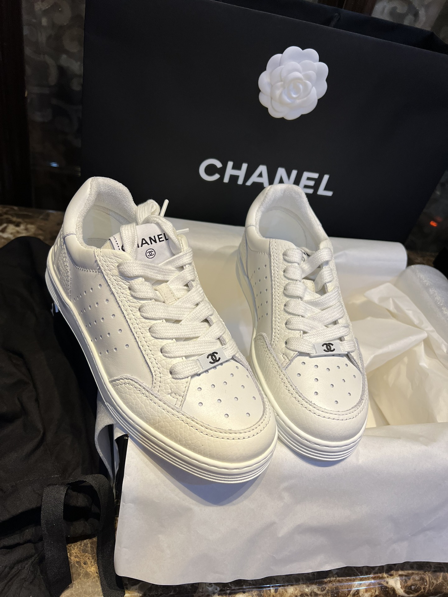 Chanel Embossed White Sneakers