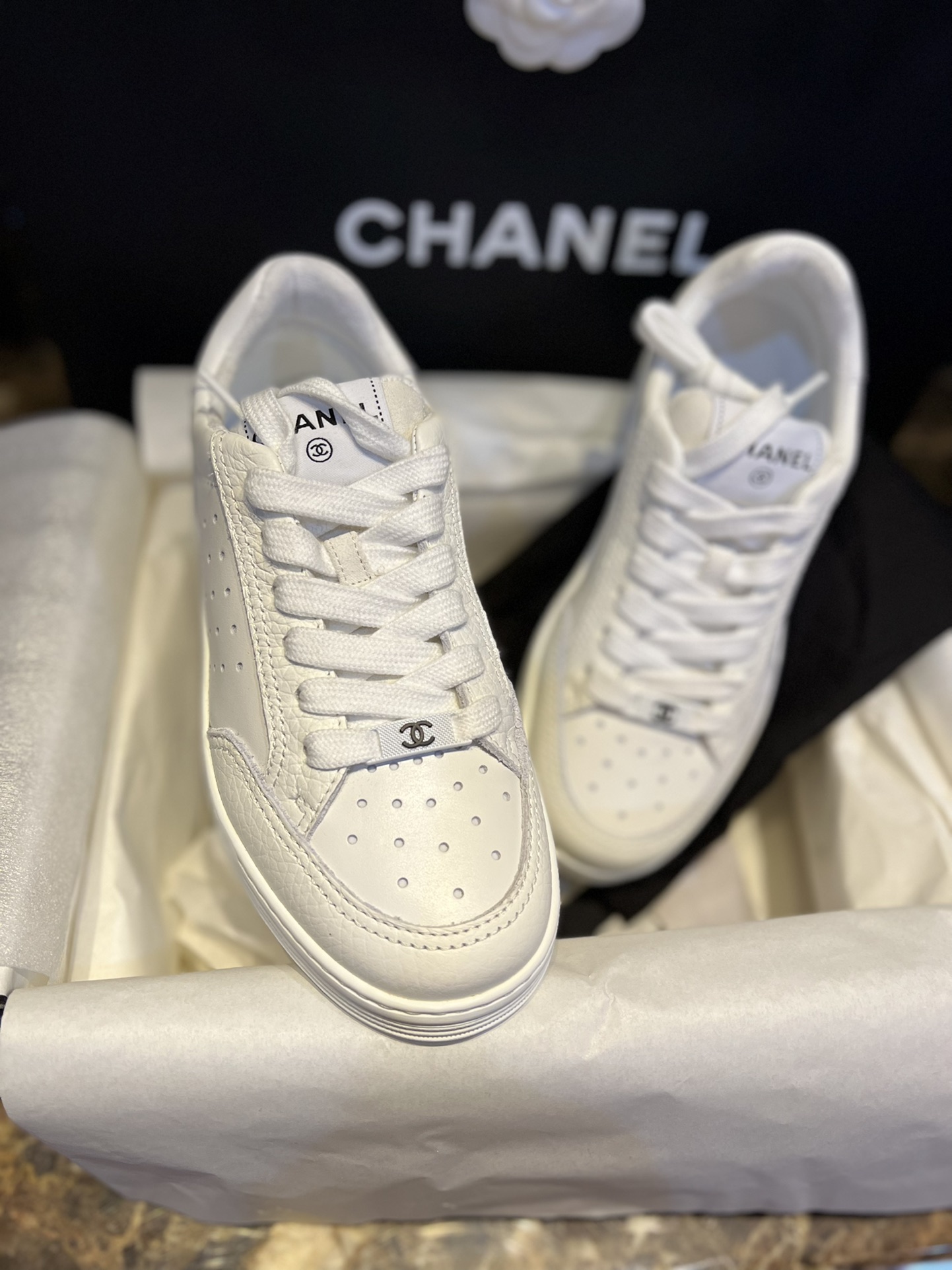 Chanel Embossed White Sneakers