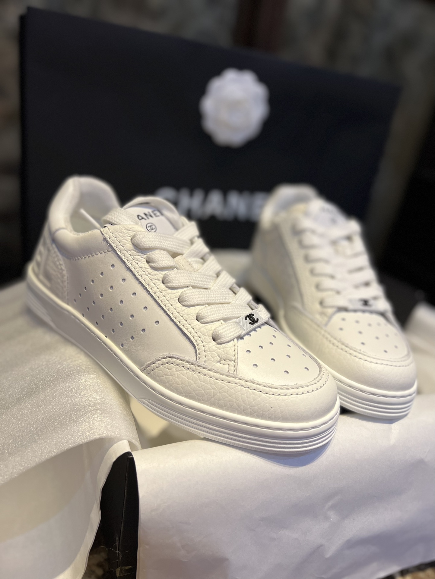 Chanel Embossed White Sneakers