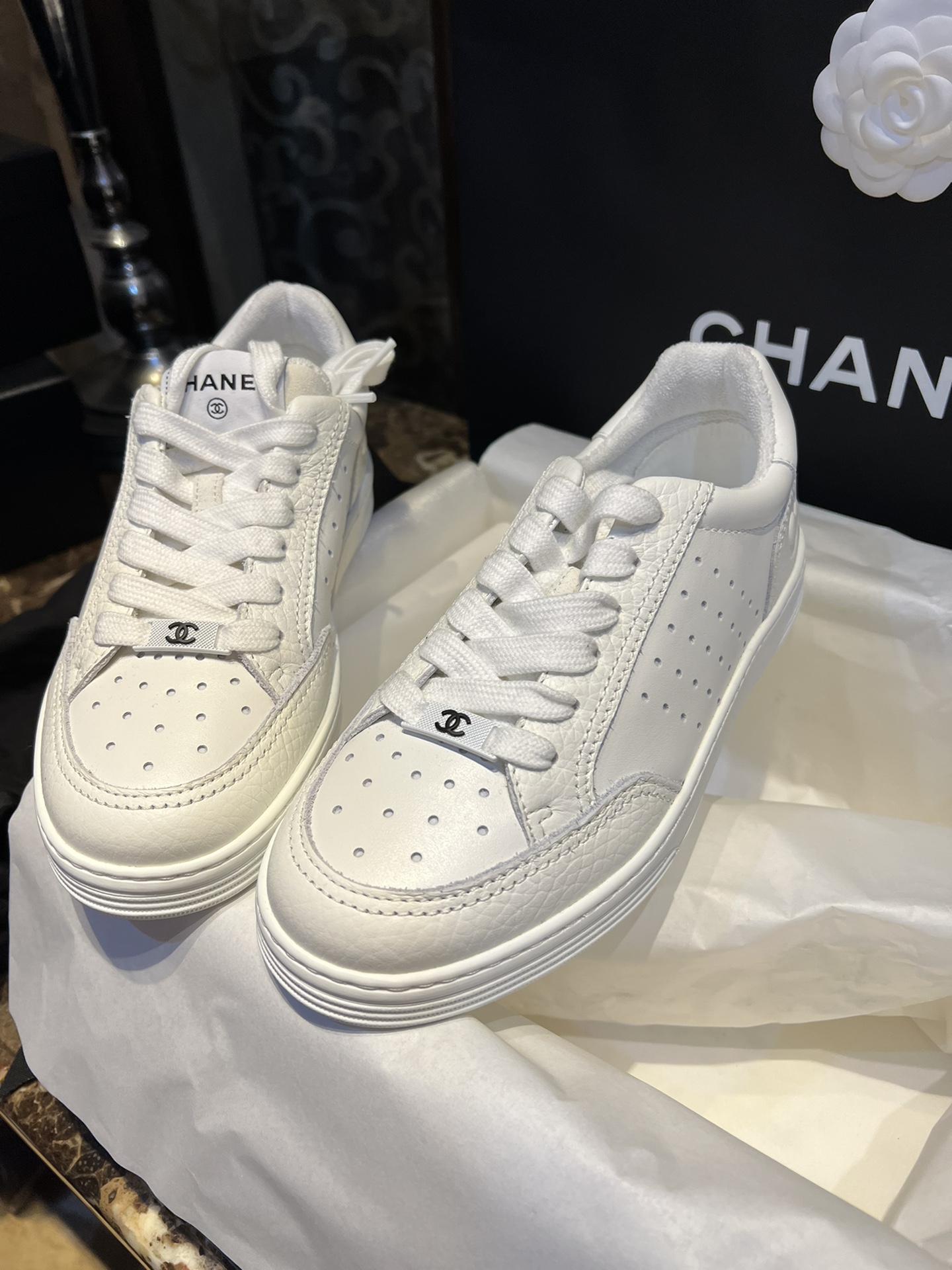 Chanel Embossed White Sneakers