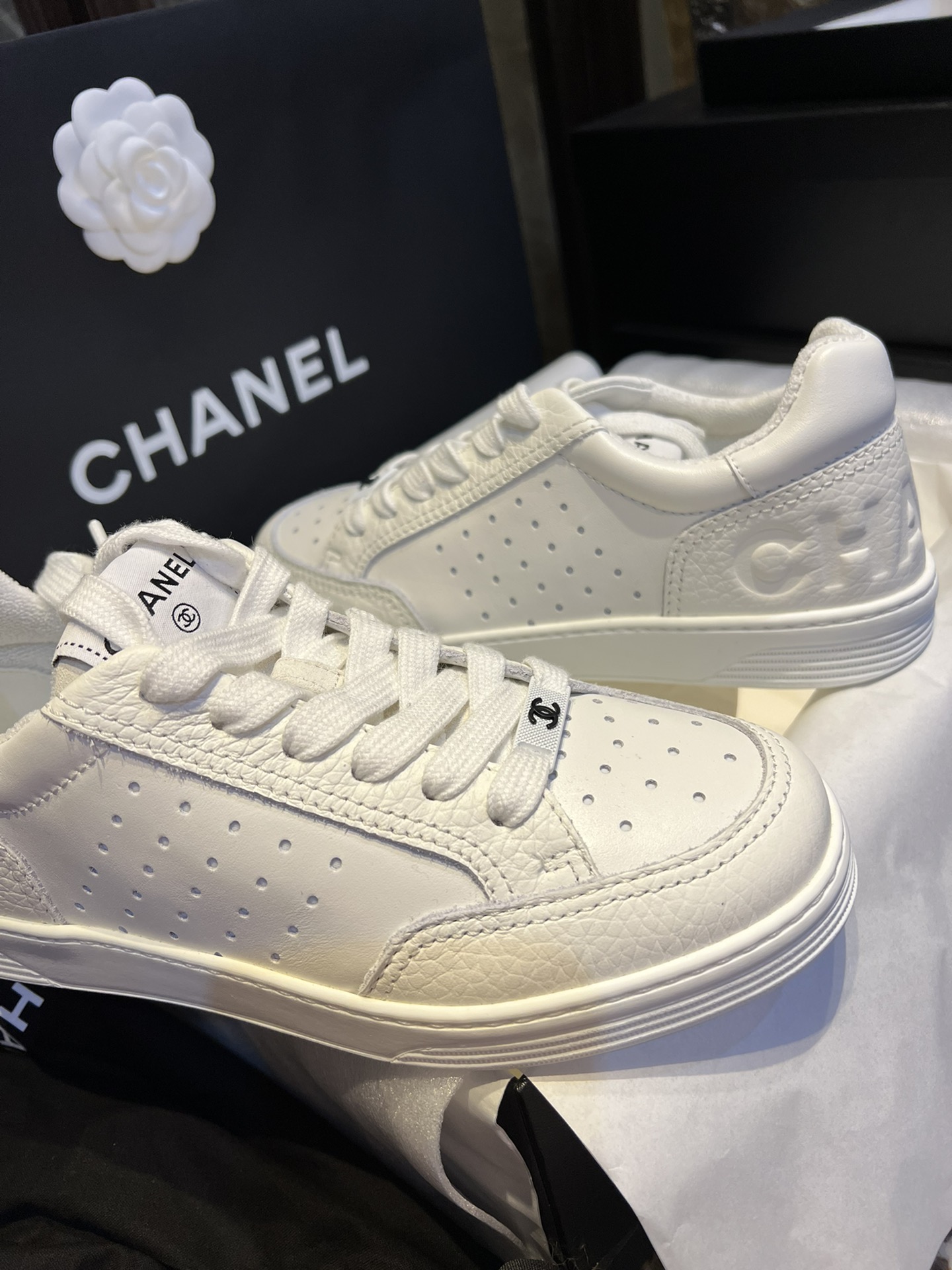 Chanel Embossed White Sneakers