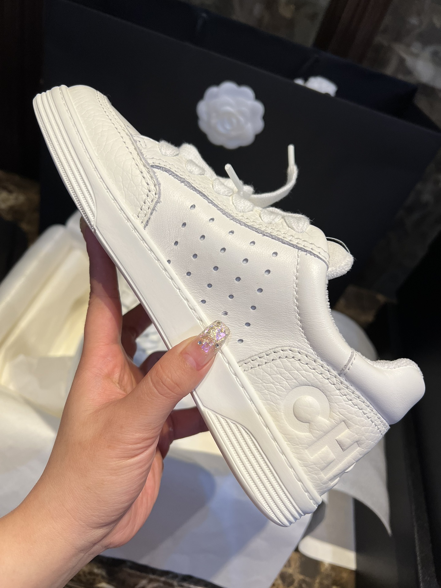 Chanel Embossed White Sneakers