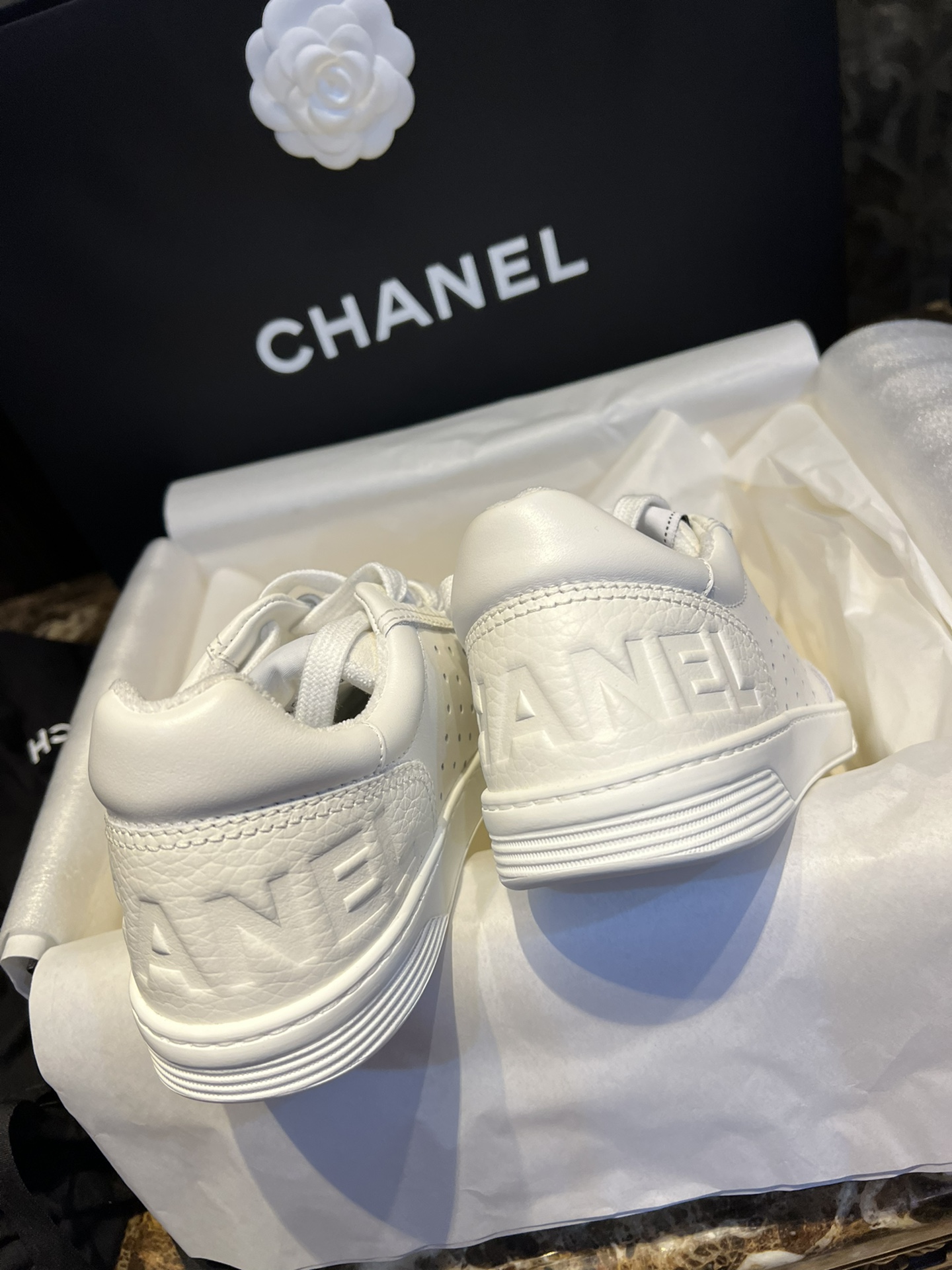 Chanel Embossed White Sneakers