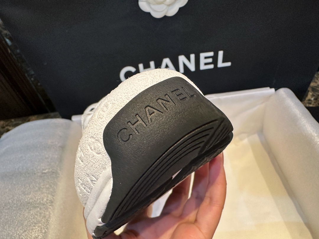 Chanel Solid Color Embossed Pattern Sneakers