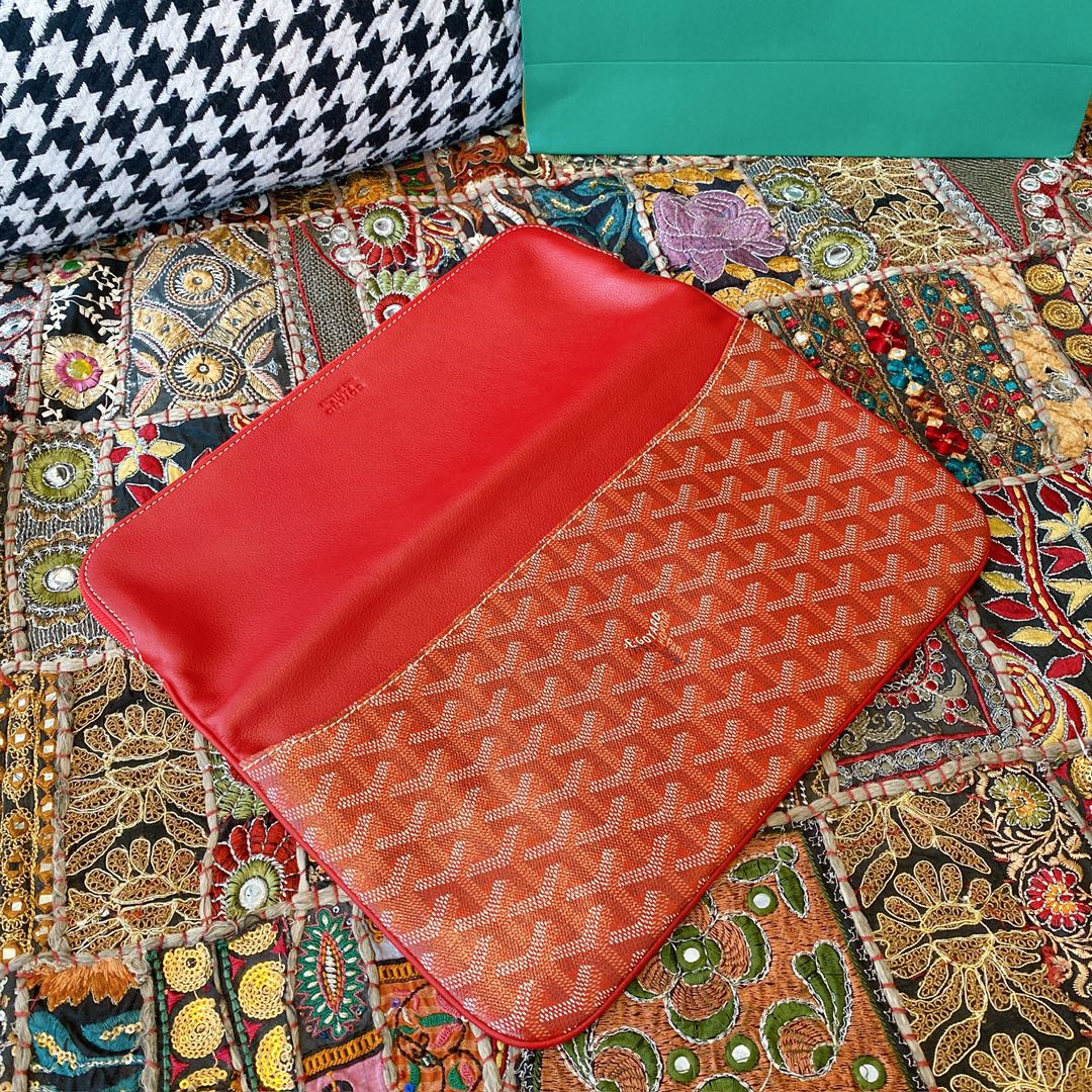 Goyard Sainte Marie Clutch, featuring a double-sided flap design with Goyardine canvas flap, two exterior patch pockets, and one large-sized zippered compartment. Size: 30X2X17cm