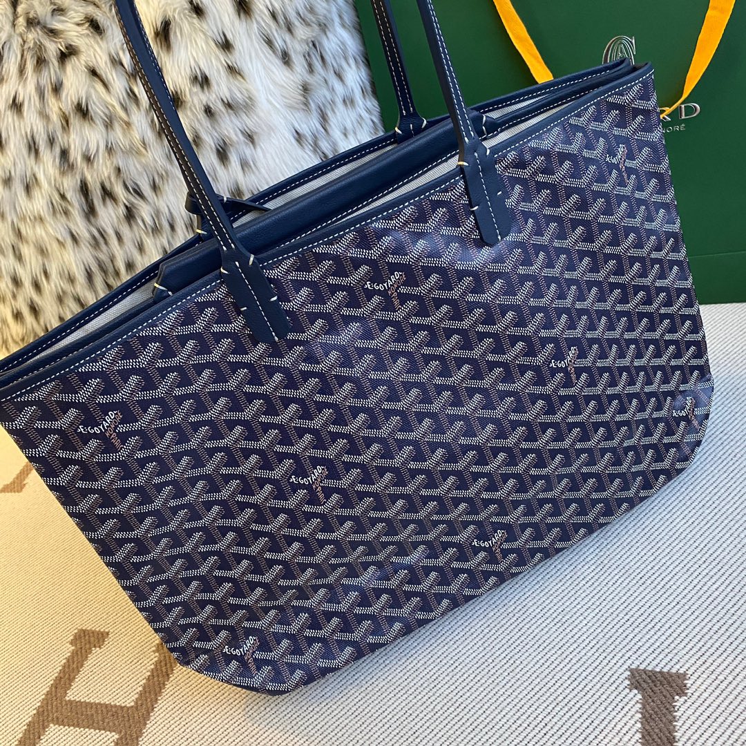 Goyard Isabelle Double-layer Tote Shopping Bag features two large shopping compartments with a magnetic snap closure calfskin divider in the middle, perfect for storing cards and cash for easy access. Size:25*14*35cm. 