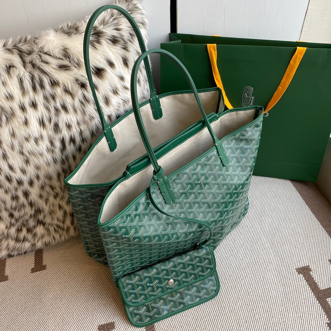 Goyard Isabelle Double-layer Tote Shopping Bag features two large shopping compartments with a magnetic snap closure calfskin divider in the middle, perfect for storing cards and cash for easy access. Size:25*14*35cm. 