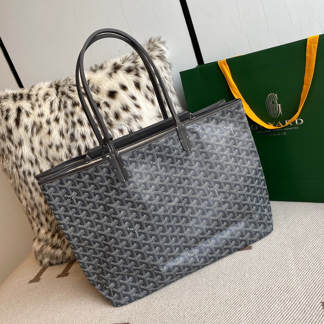 Goyard Isabelle Double-layer Tote Shopping Bag features two large shopping compartments with a magnetic snap closure calfskin divider in the middle, perfect for storing cards and cash for easy access. Size:25*14*35cm. 