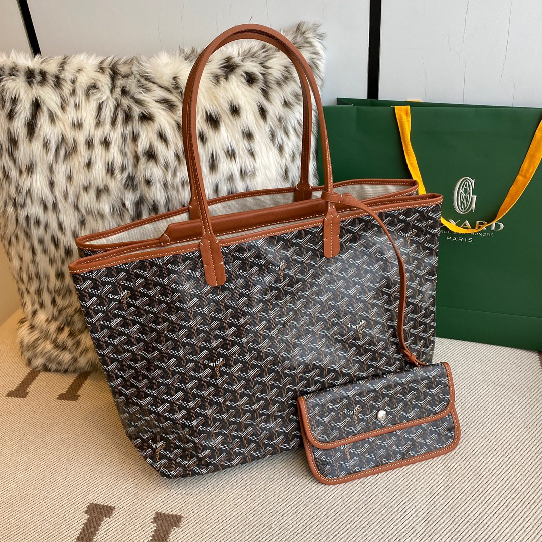 Goyard Isabelle Double-layer Tote Shopping Bag features two large shopping compartments with a magnetic snap closure calfskin divider in the middle, perfect for storing cards and cash for easy access. Size:25*14*35cm. 