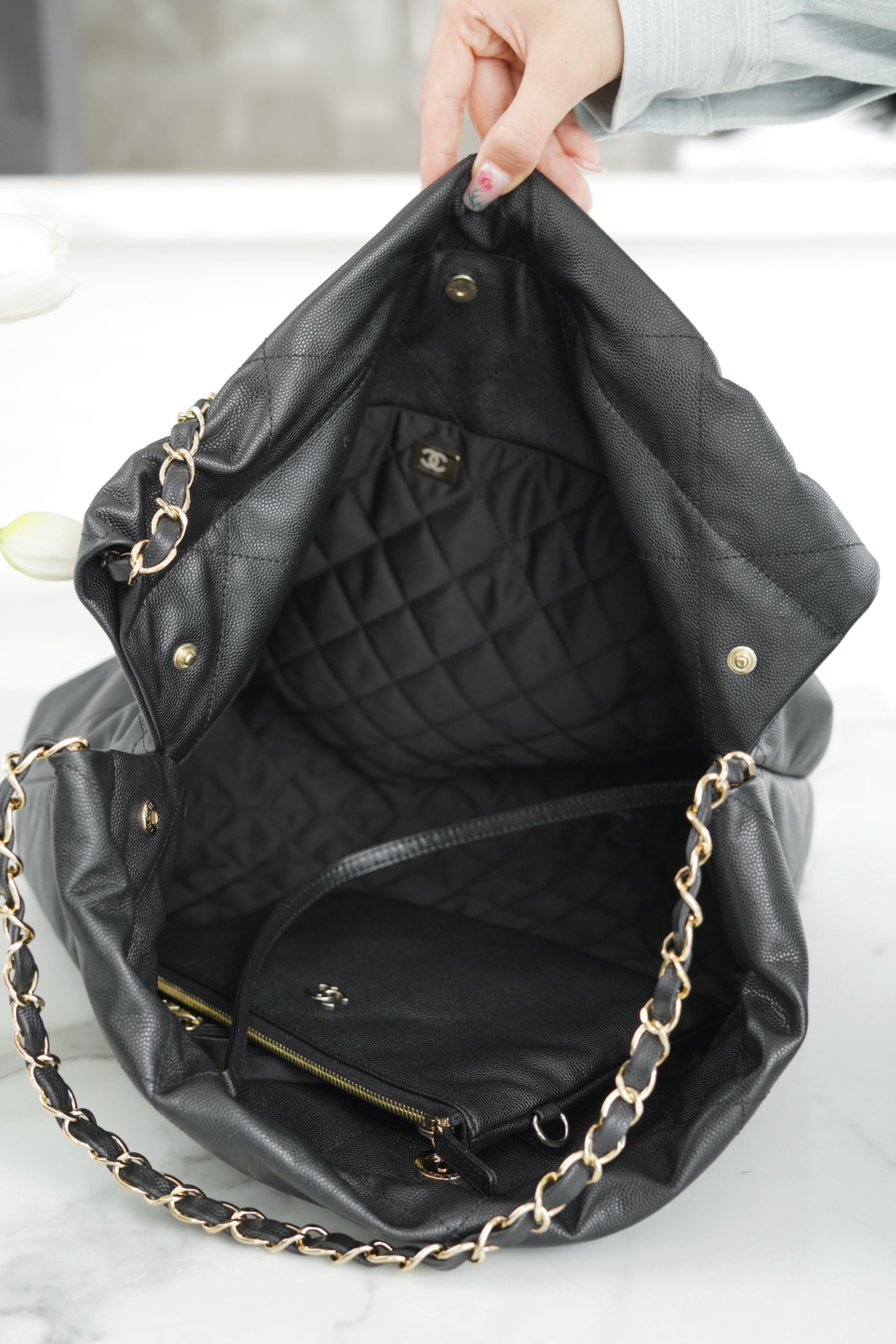 CHANEL 22P Handbag Black and Gold Caviar Leather  