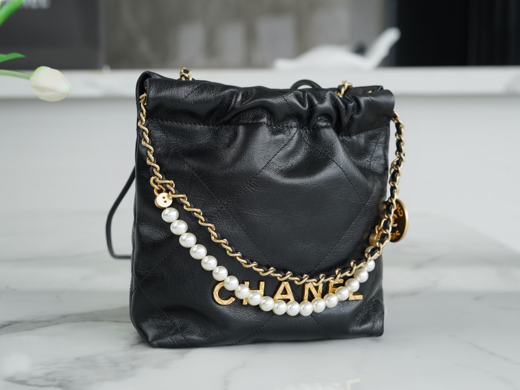 Chanel 23S 22Mini Pearl Chain Bag, Black, Wrinkled Calfskin