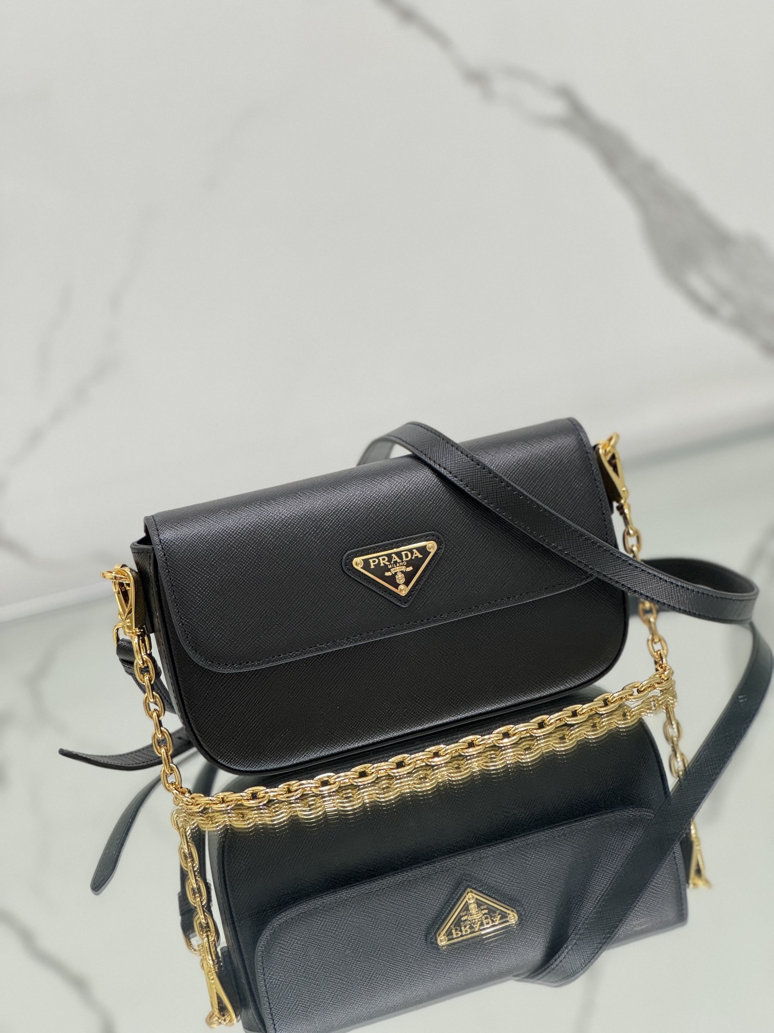 New chain crossbody bag, made of Saffiano leather with lamb leather interior, Model No: 1BD356  