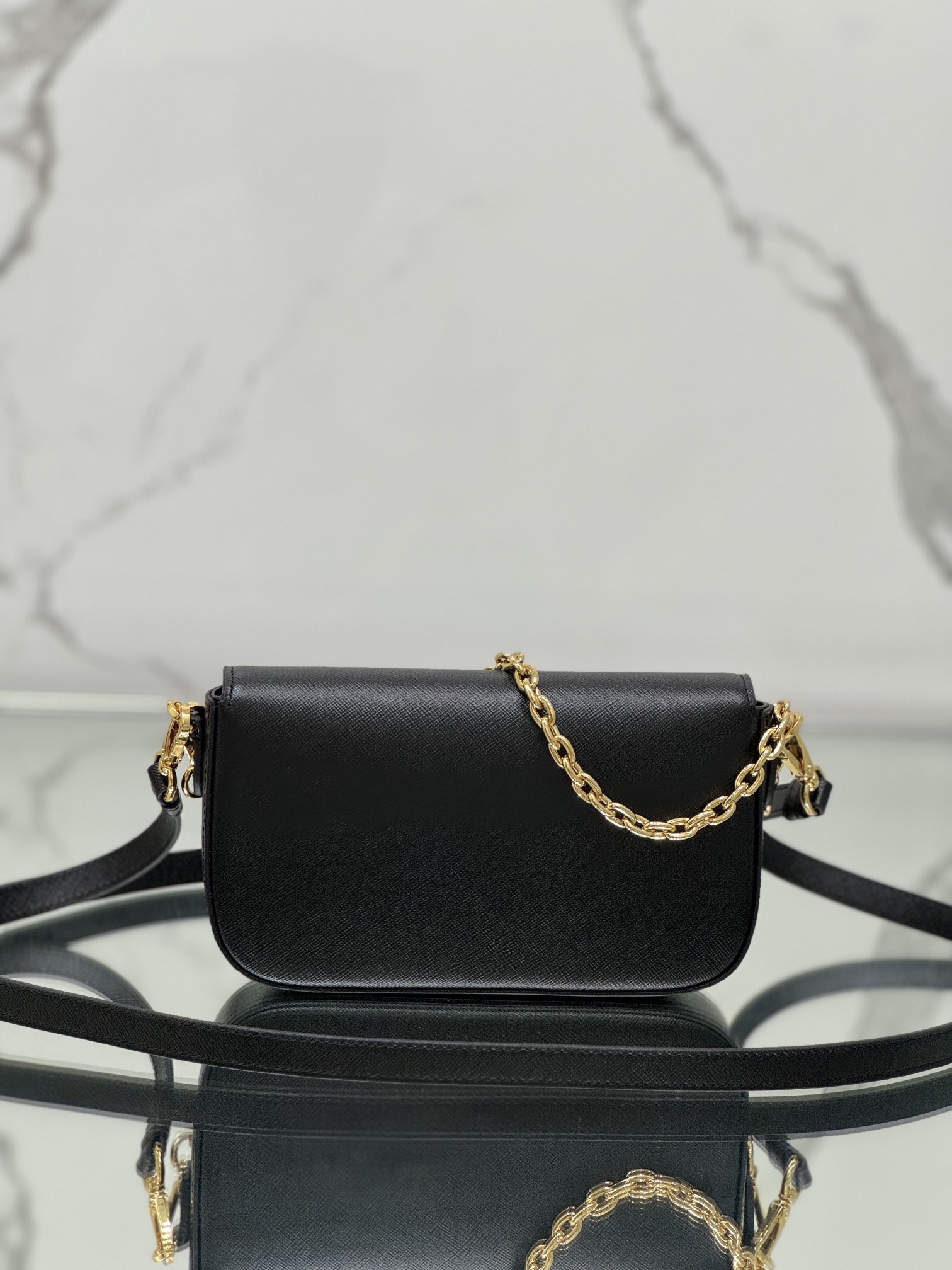 New chain crossbody bag, made of Saffiano leather with lamb leather interior, Model No: 1BD356  