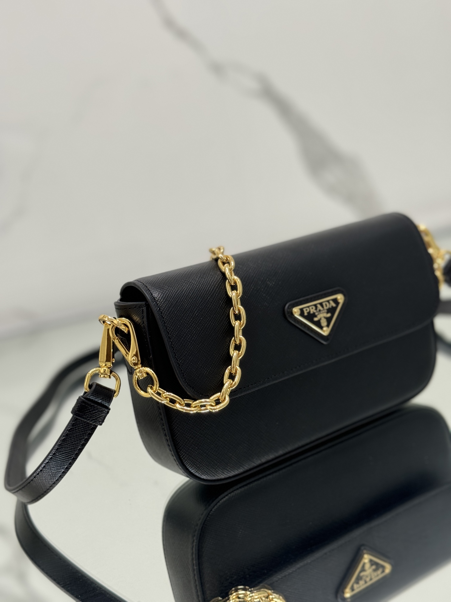 New chain crossbody bag, made of Saffiano leather with lamb leather interior, Model No: 1BD356  