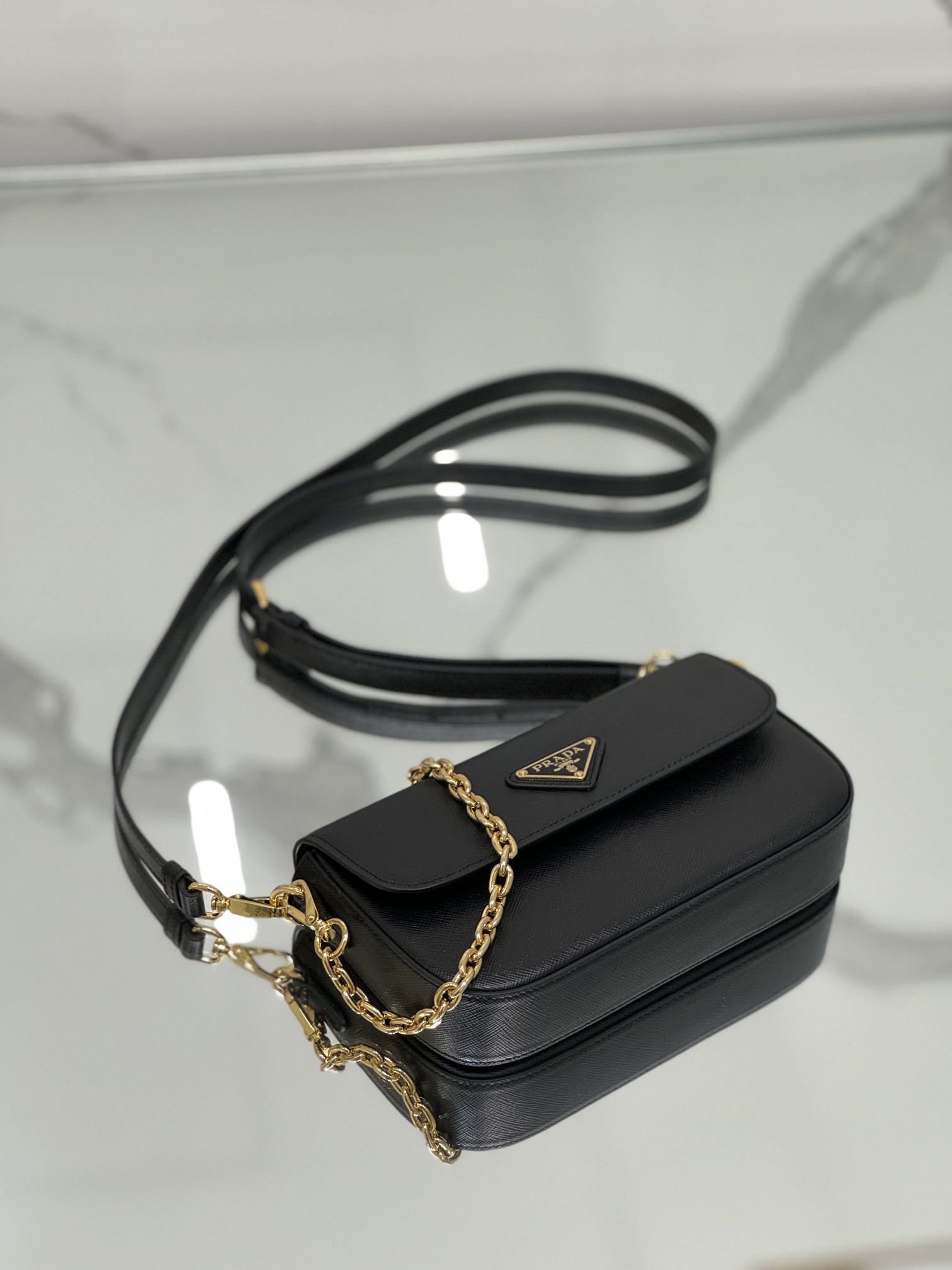 New chain crossbody bag, made of Saffiano leather with lamb leather interior, Model No: 1BD356  