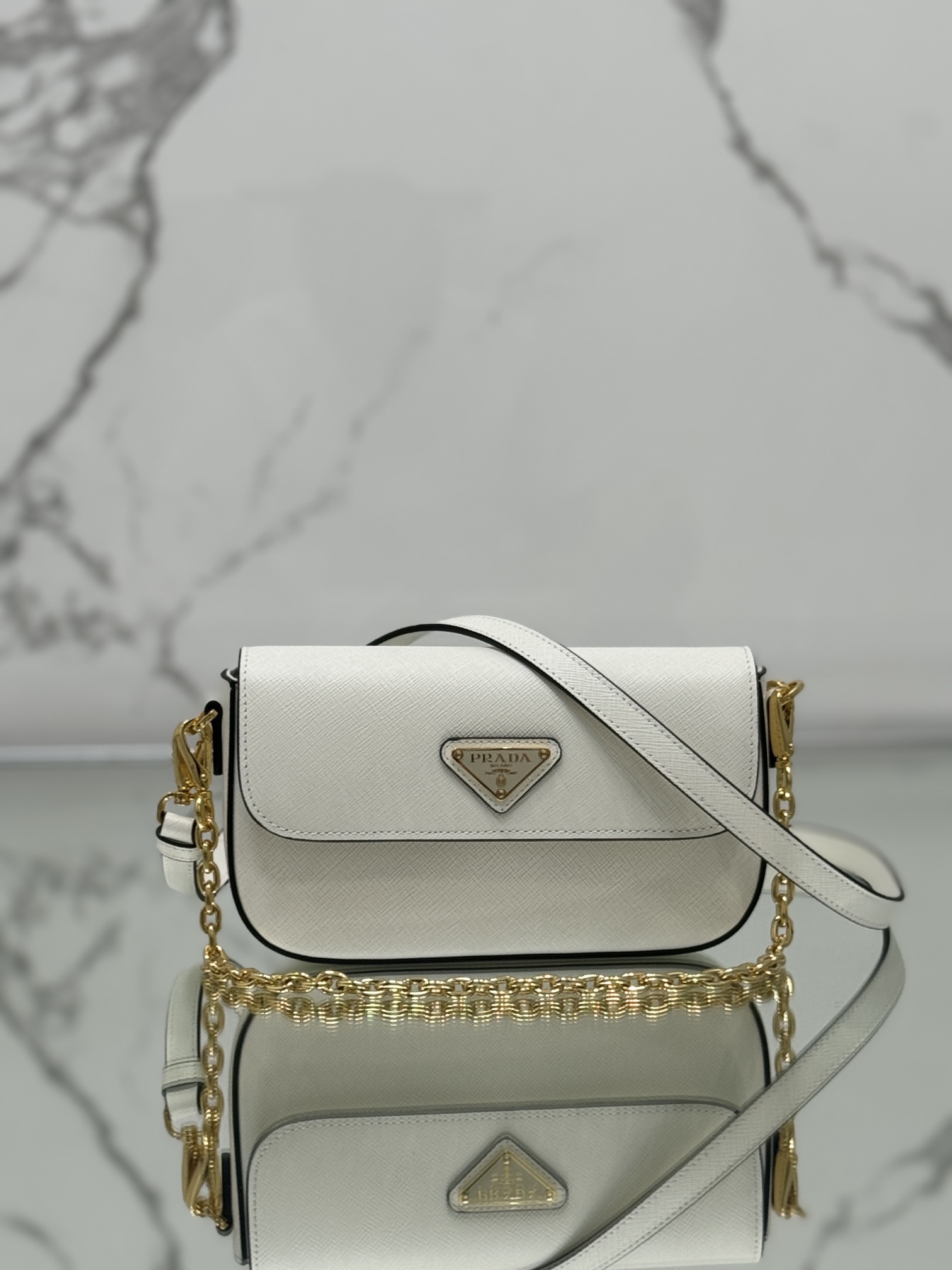 New chain crossbody bag, made of Saffiano leather with lamb leather interior, Model No: 1BD356  