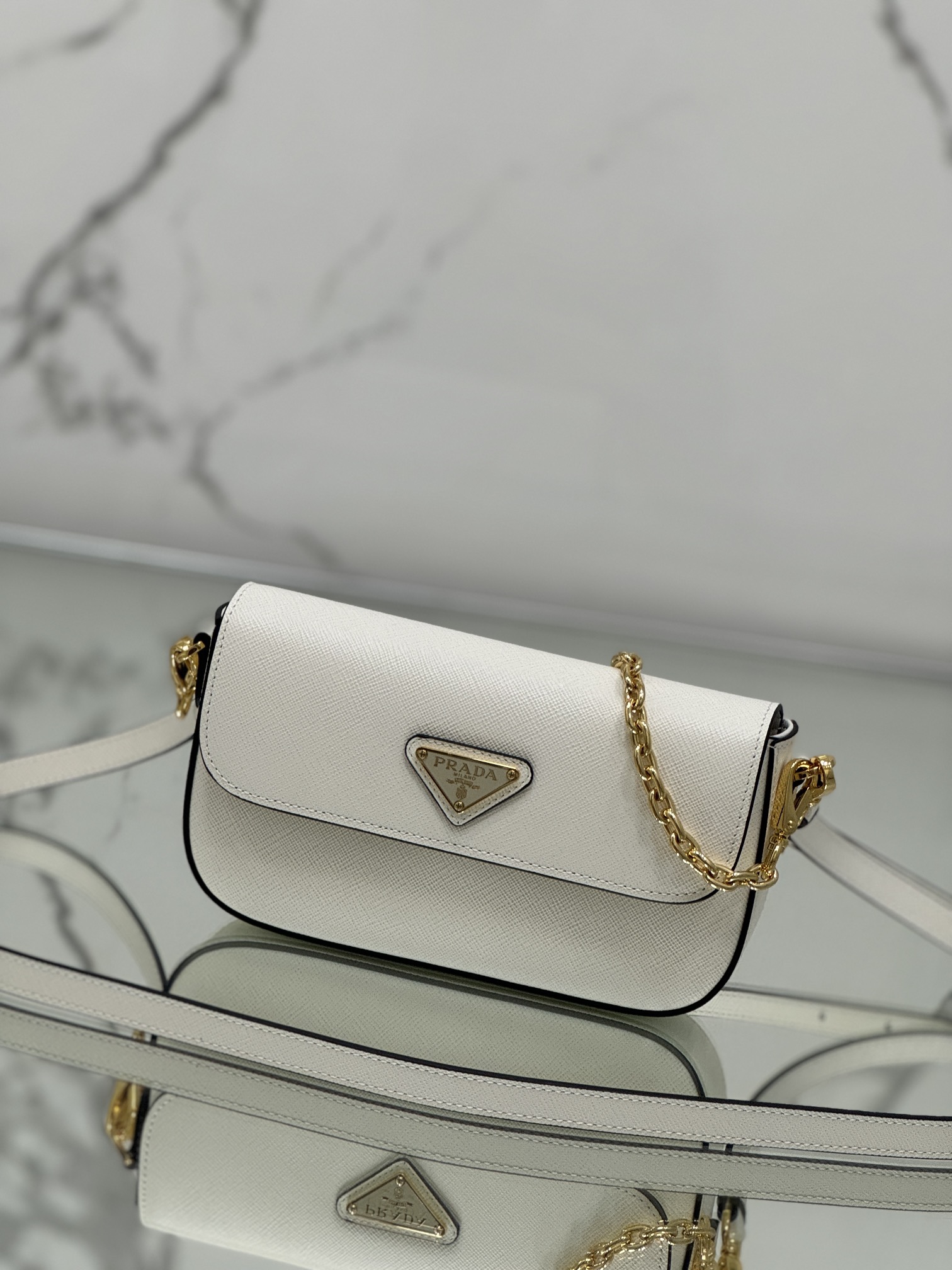 New chain crossbody bag, made of Saffiano leather with lamb leather interior, Model No: 1BD356  