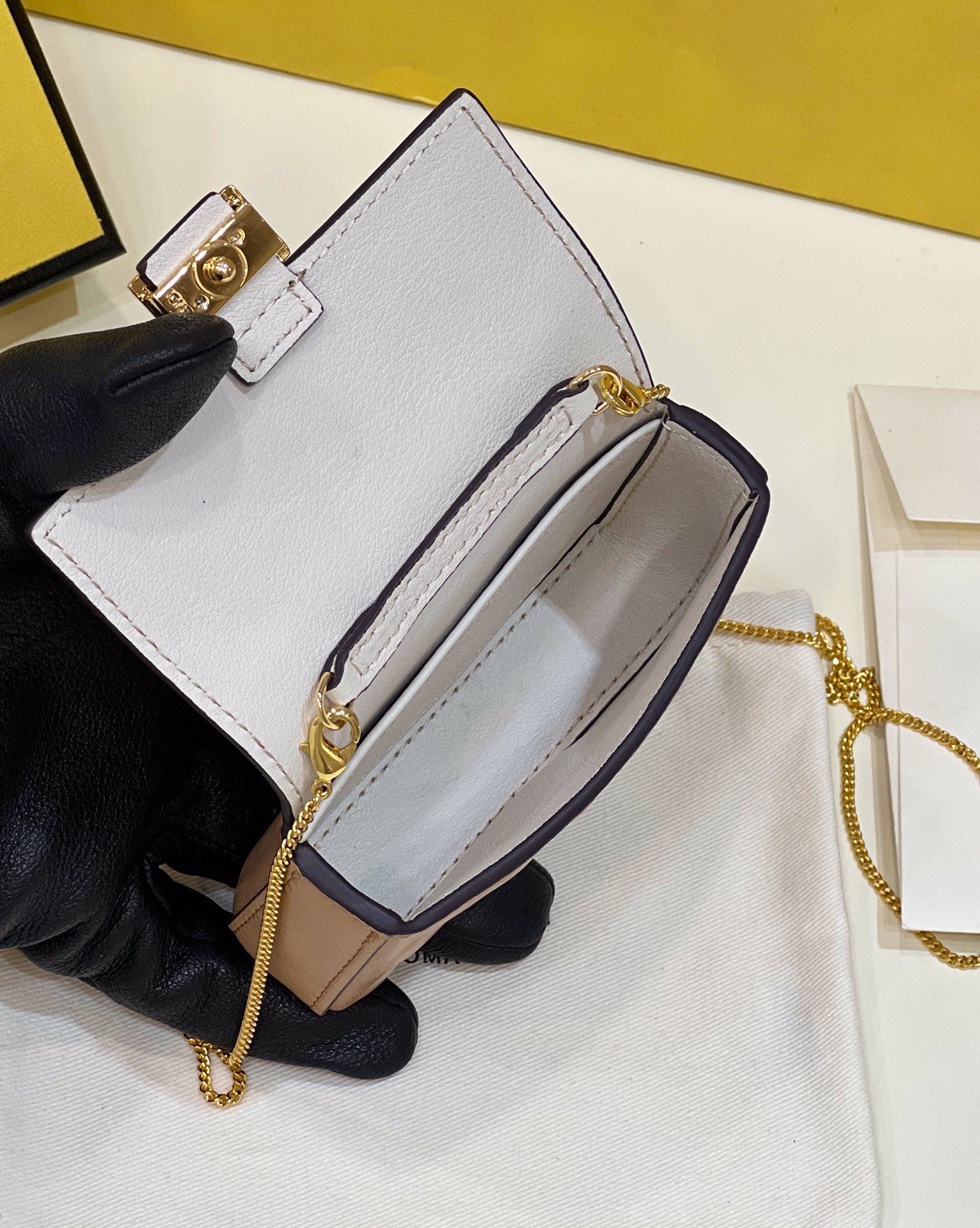 Fendi nano baguette, soft delicate lambskin with long chain shoulder strap Model no: 0136F